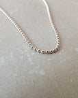 Becoming Jewelry's Sterling Silver Bead Chain Necklace on a light gray surface.