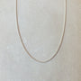 A Becoming Jewelry sterling silver curb chain necklace displayed on a neutral background.