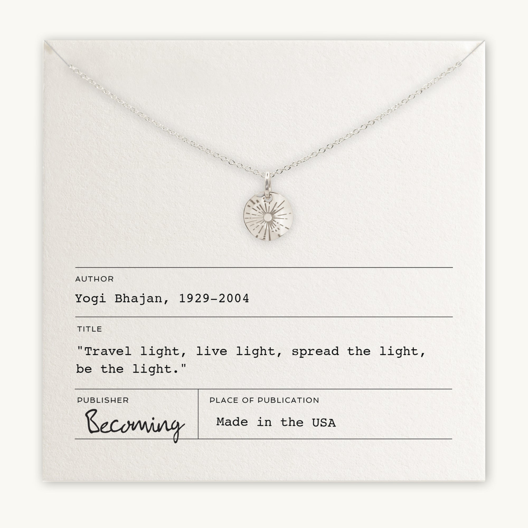 Becoming Jewelry&#39;s &quot;Be The Light Necklace&quot; displayed on a card with an inspirational quote by Yogi Bhajan and branding information.