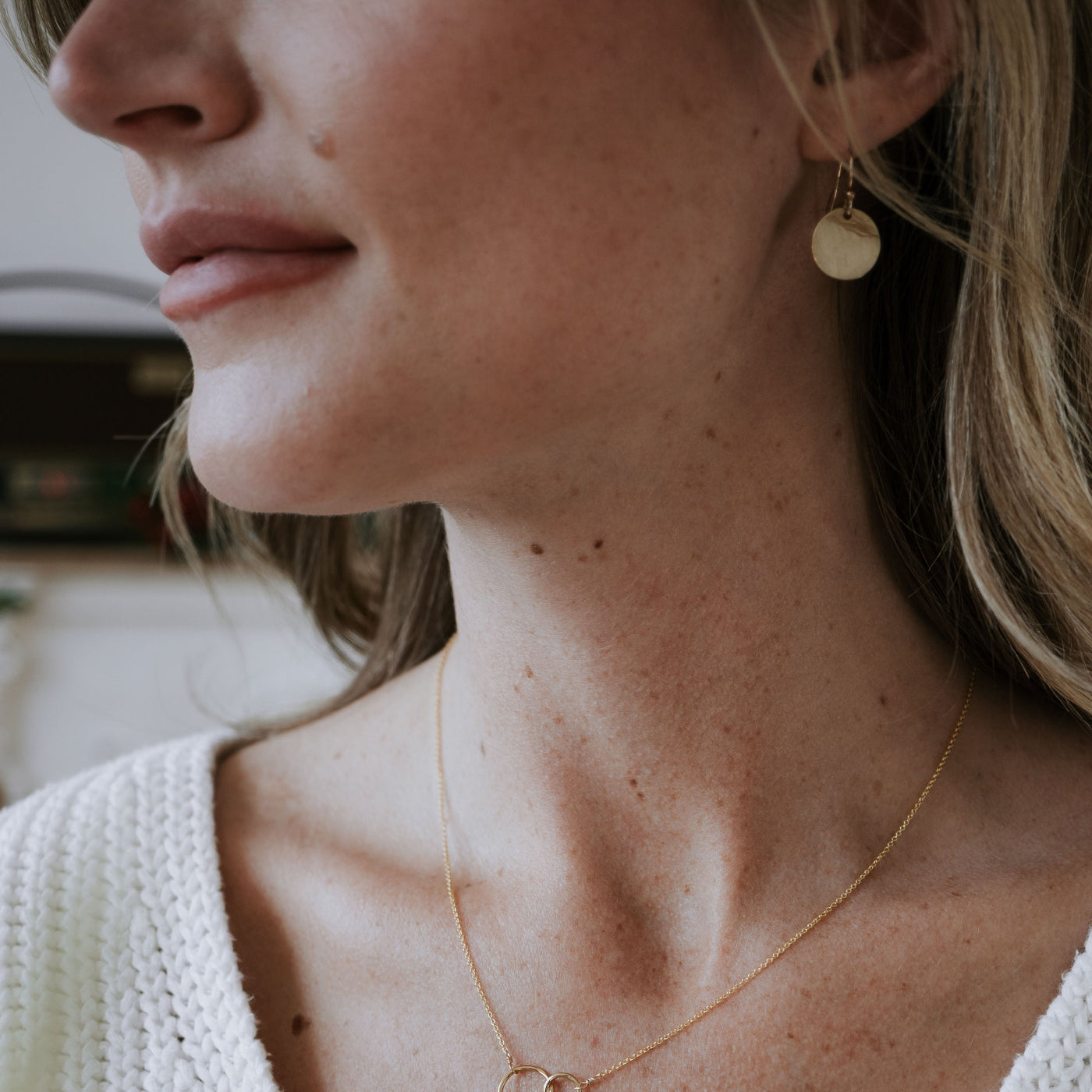 Model wearing lightly hammered simple round earrings