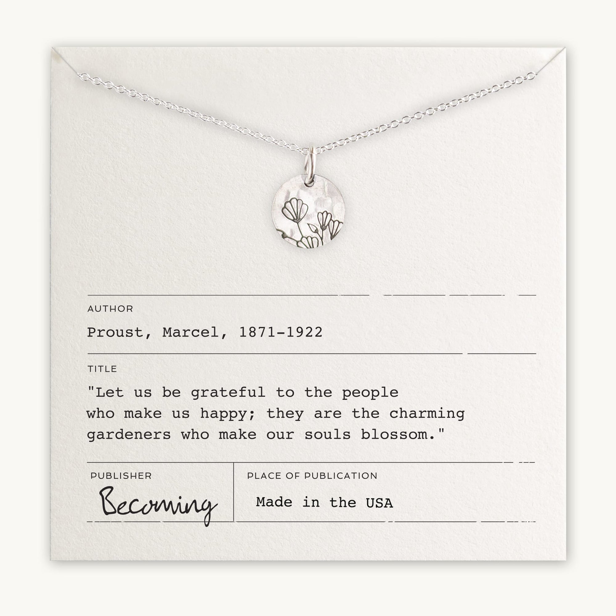 Becoming Jewelry&#39;s Blossom Necklace with a tree pendant on a card with a Marcel Proust quote about gratitude and happiness.