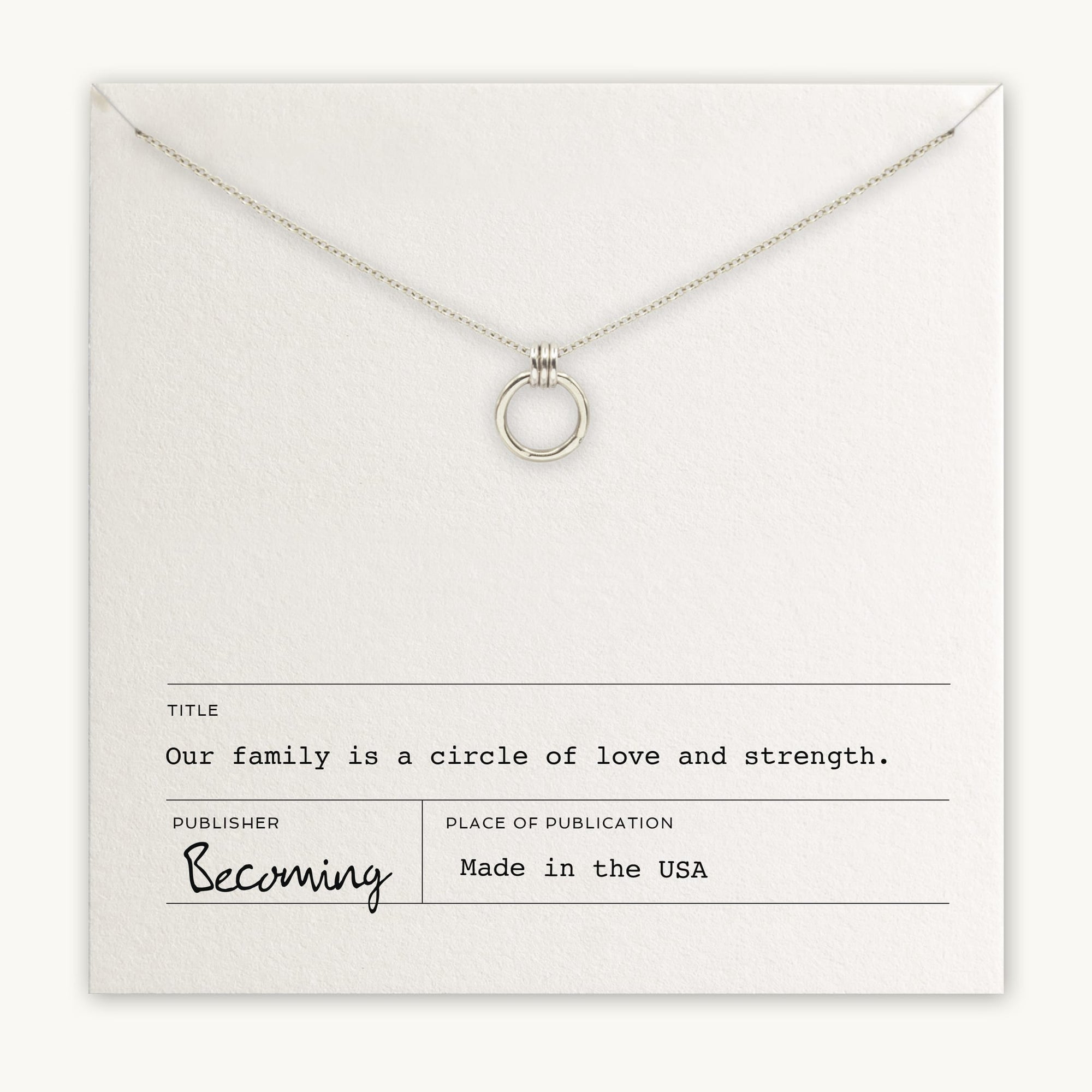 The Family Circle Necklace by Becoming Jewelry features a silver circle pendant displayed on a card that reads: "Our family is a circle of love and strength." Made in the USA, this piece from Becoming Jewels is the perfect go-to gift, symbolizing strength and love for any family member.