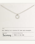 Becoming Jewelry's Family Circle Necklace on a display card with inspirational text about family love and strength, indicating the product is made in the USA.