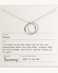 The Friendship Circles Necklace by Becoming Jewelry features two interlocking silver circles on a card with a thoughtful quote about friendship attributed to an unknown author. Made in the USA, this elegant necklace makes an ideal gift.
