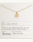 Becoming Jewelry's Heart Necklace, featuring a small heart pendant, is elegantly displayed on a card with an inspiring quote from L. Frank Baum: "A heart is not judged by how much you love, but by how much you are loved by others." Made in the USA, this beautiful piece makes for a deeply meaningful gift.