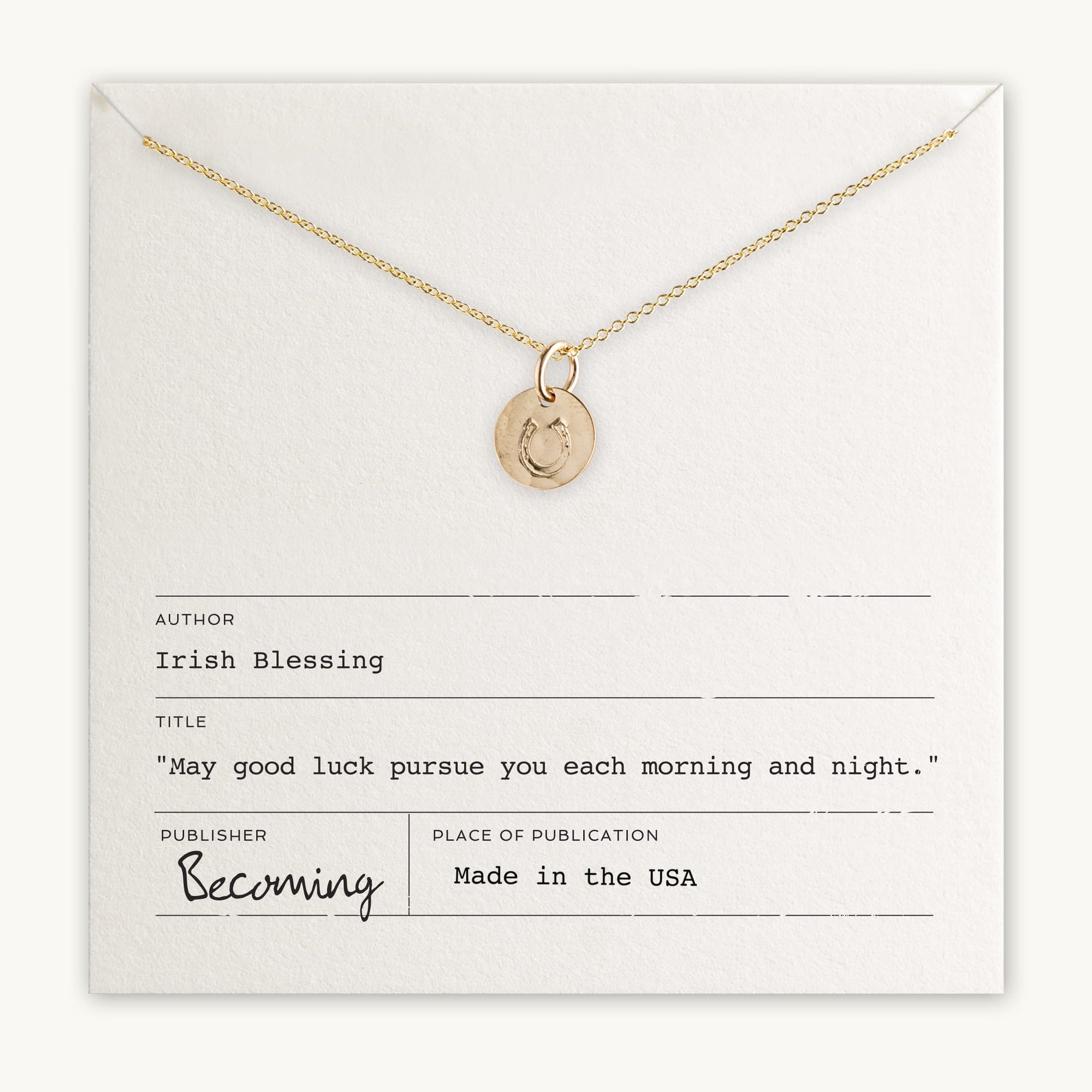 Becoming Jewelry&#39;s Horseshoe pendant necklace with Irish blessing displayed on a card.