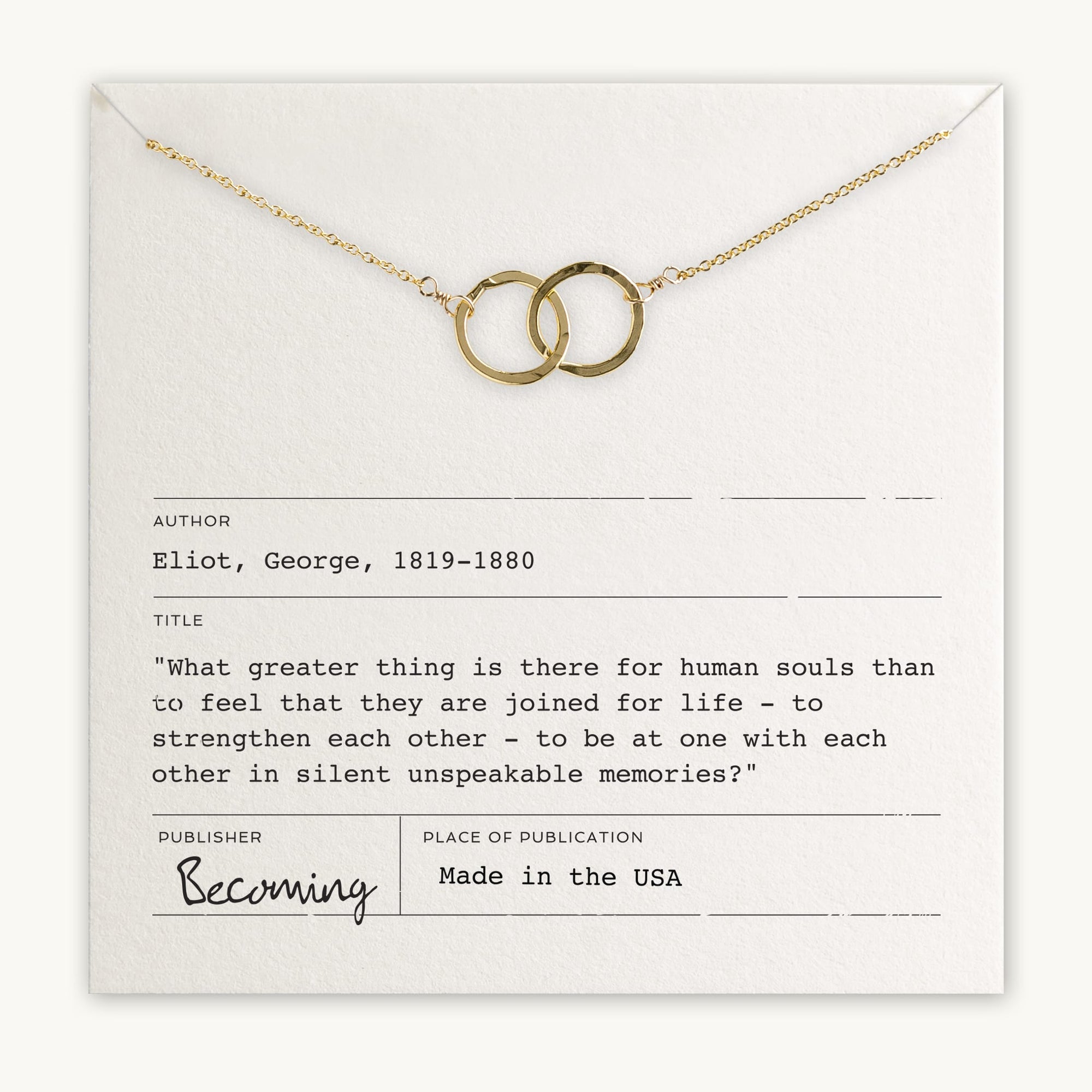 Joined for Life necklace from Becoming Jewelry with interlocking circles on a card with a George Eliot quote about human connection.