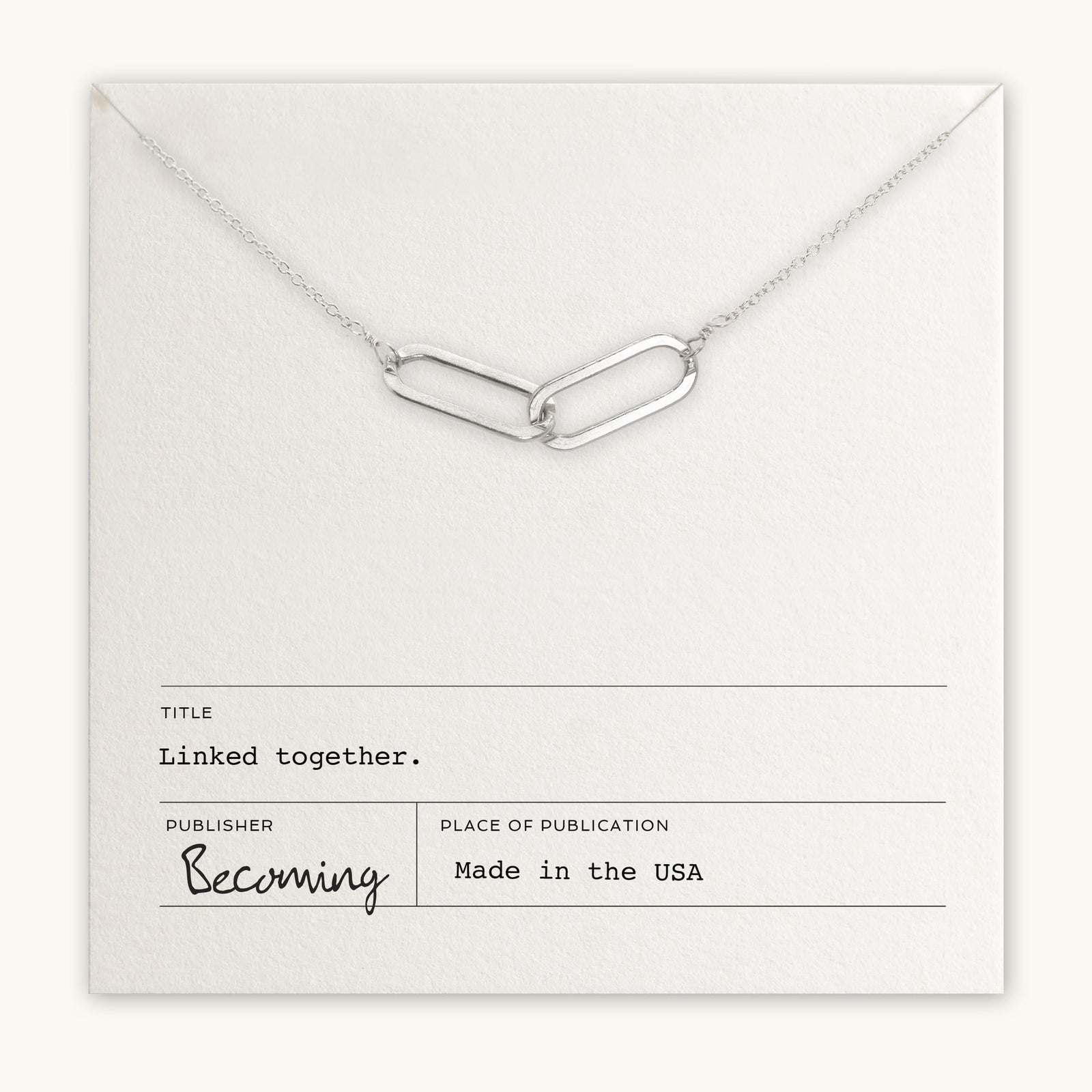 Linked Together Necklace by Becoming Jewelry with an interlinked design on a display card titled 
