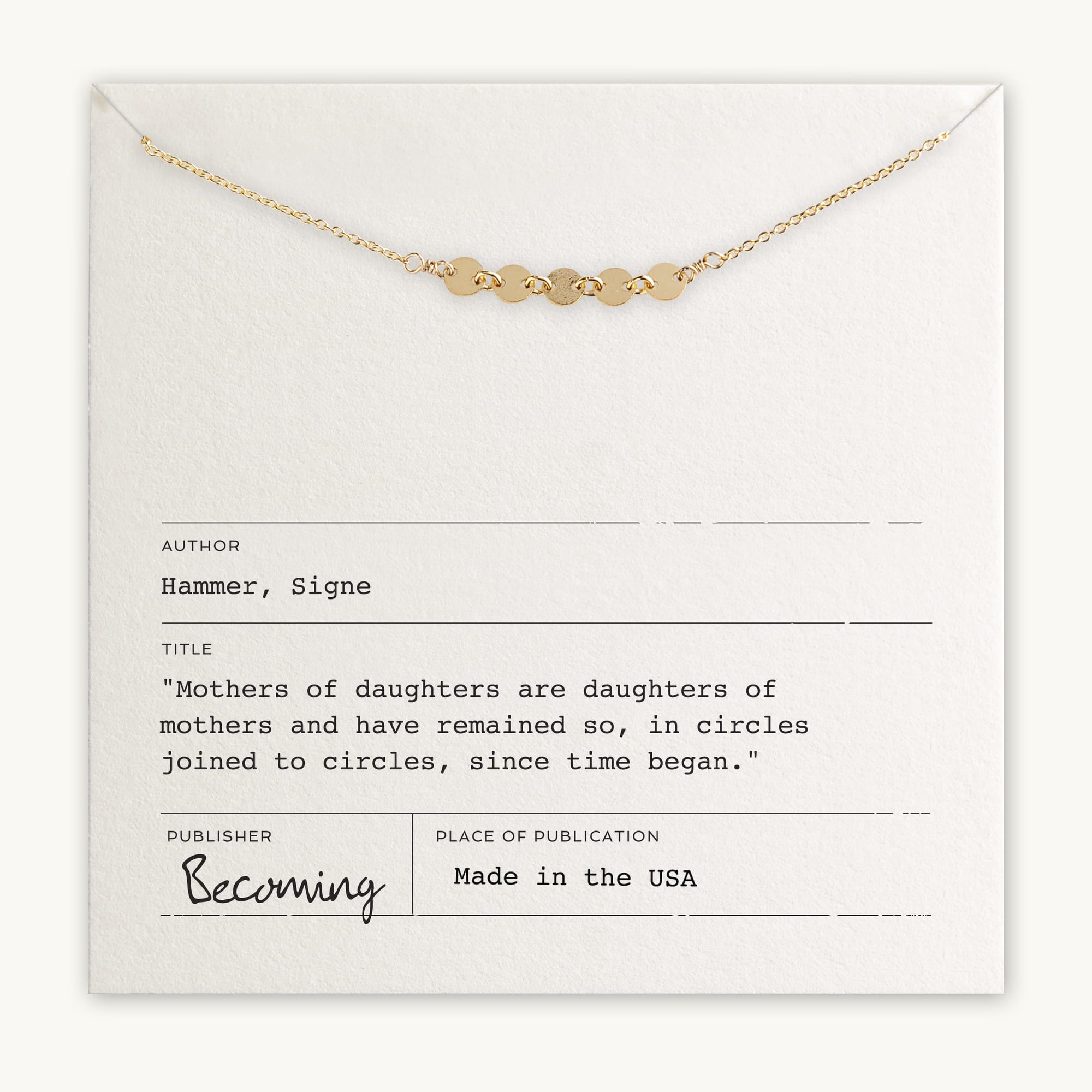 A gold necklace with small circular links is displayed atop a card that quotes Signe Hammer on the connection between mothers and daughters. The card mentions "Becoming Jewelry" as the brand. This Mothers & Daughters Necklace makes a lovely gift of connection for any special woman in your life.