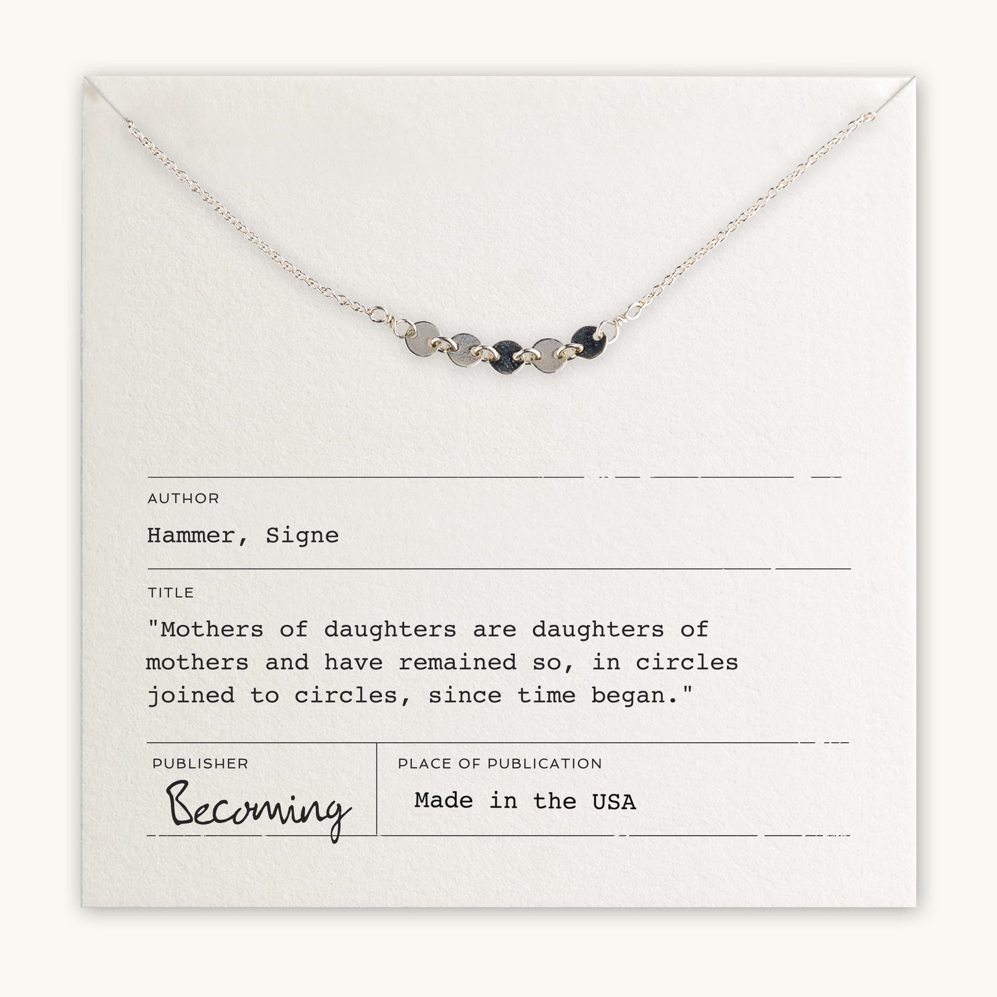 Mothers &amp; Daughters Necklace by Becoming Jewelry with five joined circles charm on a display card featuring a quote about mothers and daughters, indicating the necklace is made in the USA.