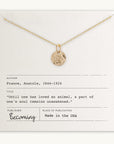 Becoming Jewelry's Paw Print Necklace displayed on a card with a quote about loving an animal, attributed to Anatole France.