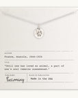 Becoming Jewelry's Paw Print Necklace with paw print charm pendant presented on a card with an Anatole France quote.