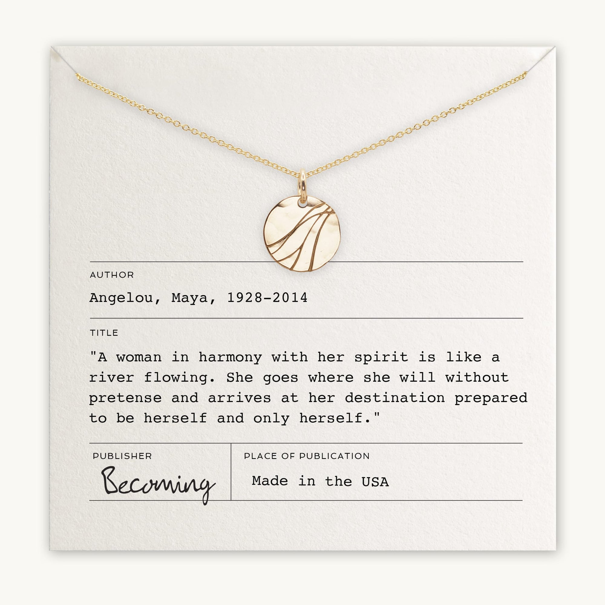 A River Necklace from Becoming Jewelry, featuring a gold round pendant, is elegantly displayed on a card that celebrates remarkable women with a quote by Maya Angelou: "A woman in harmony with her spirit is like a river flowing." The card also indicates the author and publisher.