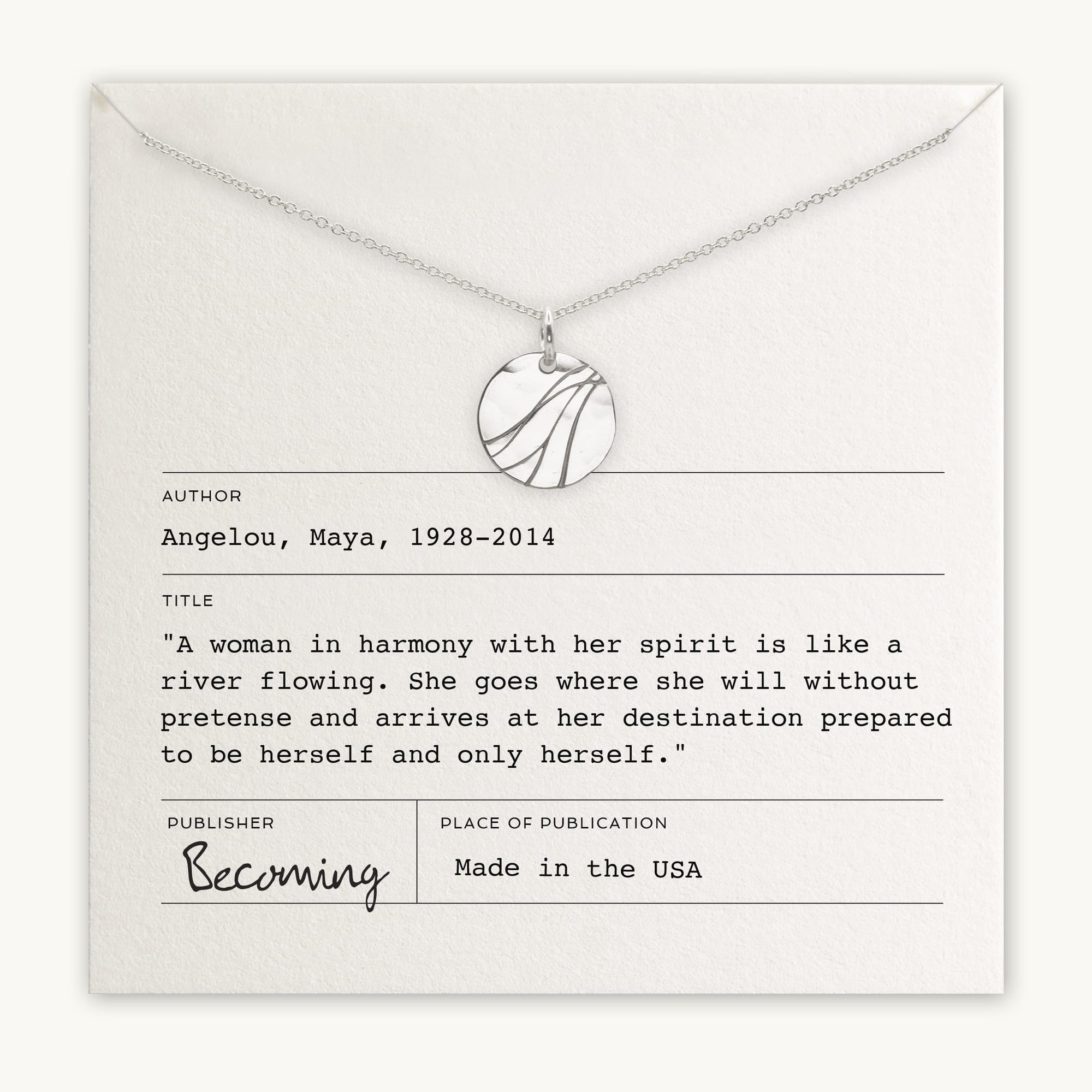 A River Necklace by Becoming Jewelry is elegantly displayed on a card adorned with a quote by Maya Angelou. The card features her name, dates, and a powerful quote about a woman's indomitable spirit, as well as publishing information. A tribute to remarkable women everywhere.