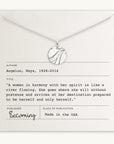A River Necklace by Becoming Jewelry is elegantly displayed on a card adorned with a quote by Maya Angelou. The card features her name, dates, and a powerful quote about a woman's indomitable spirit, as well as publishing information. A tribute to remarkable women everywhere.