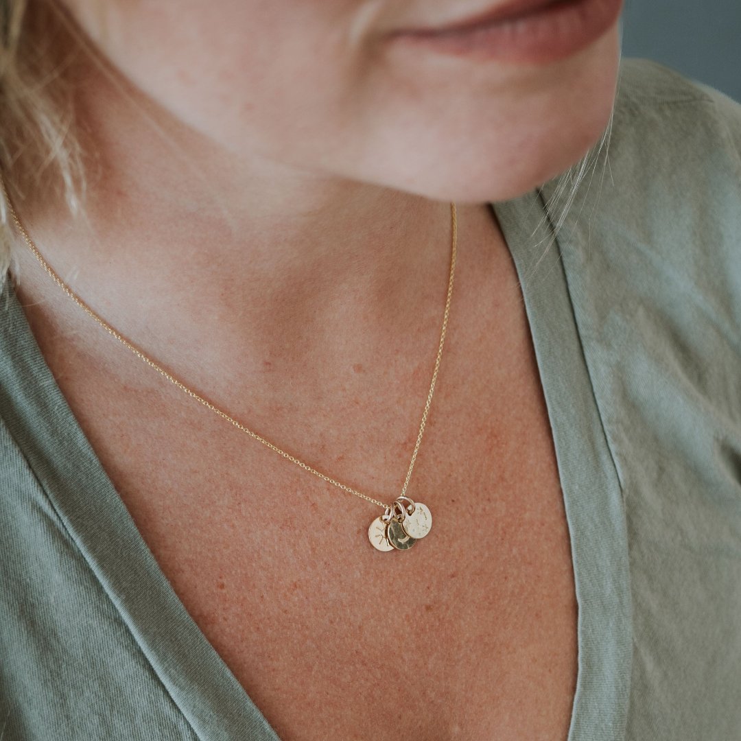 Sun moon and stars necklace on model