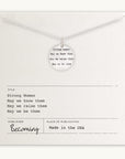 A thoughtful gift, the Strong Women Necklace by Becoming Jewelry showcases a circular pendant engraved with the empowering phrases "Strong Women, May we know them, May we raise them, May we be them." It is accompanied by a card featuring the same heartfelt message and publisher details. Ideal for daily wear to keep inspiration close.