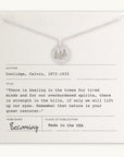 Description: A Trees Necklace from Becoming Jewelry, featuring a silver tree pendant. The necklace is displayed on a card that includes a quote by Calvin Coolidge about the healing power of nature and details such as "Made in the USA." This piece celebrates the restoration offered by nature.