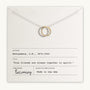 The True Friends Necklace, featuring two mixed metal interlocking circles, is presented on a card with the text, "True friends are always together in spirit," by L.M. Montgomery. This beautiful piece is crafted by Becoming Jewelry and made in the USA.