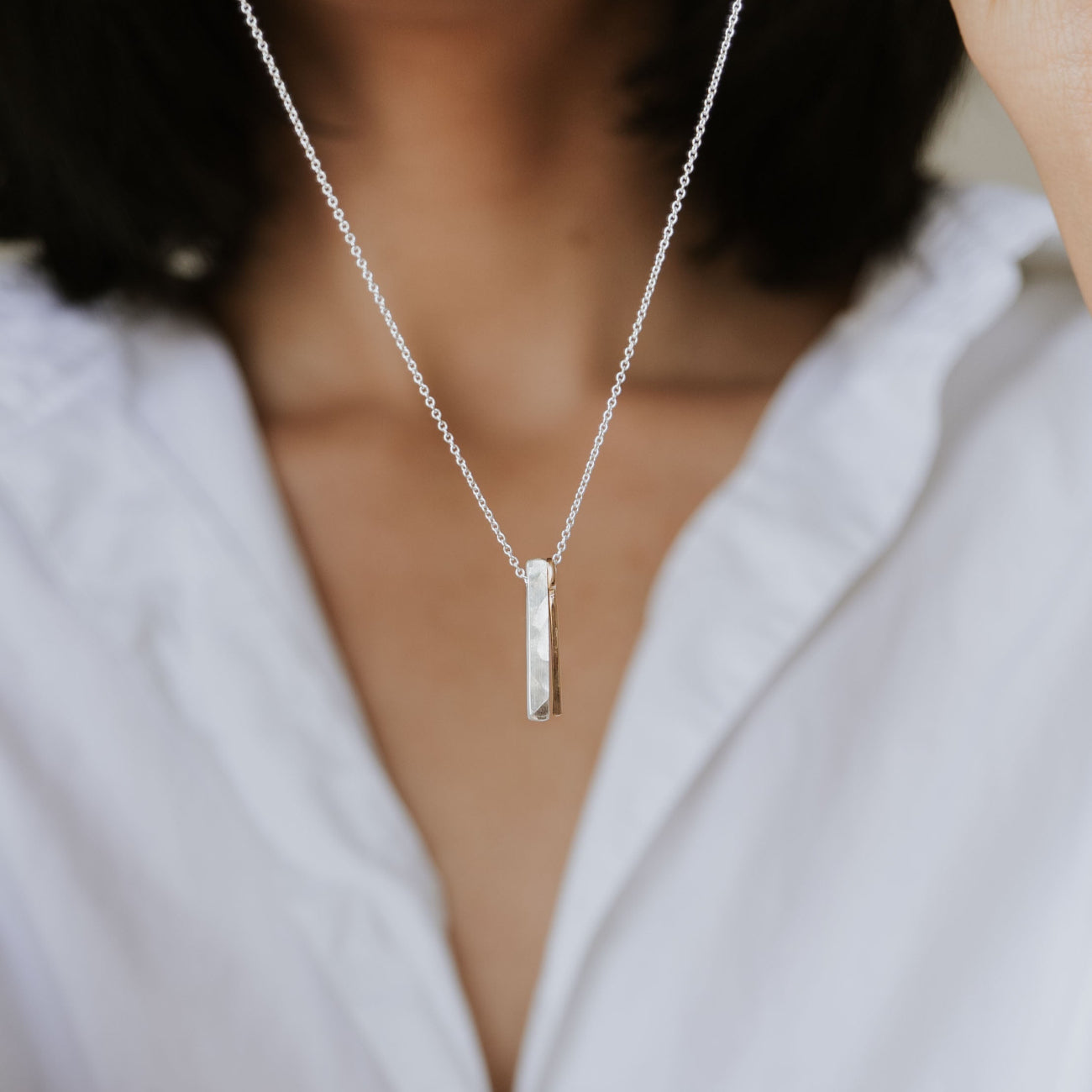 Through Thick and Thin necklace holding