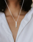 Through Thick and Thin necklace holding