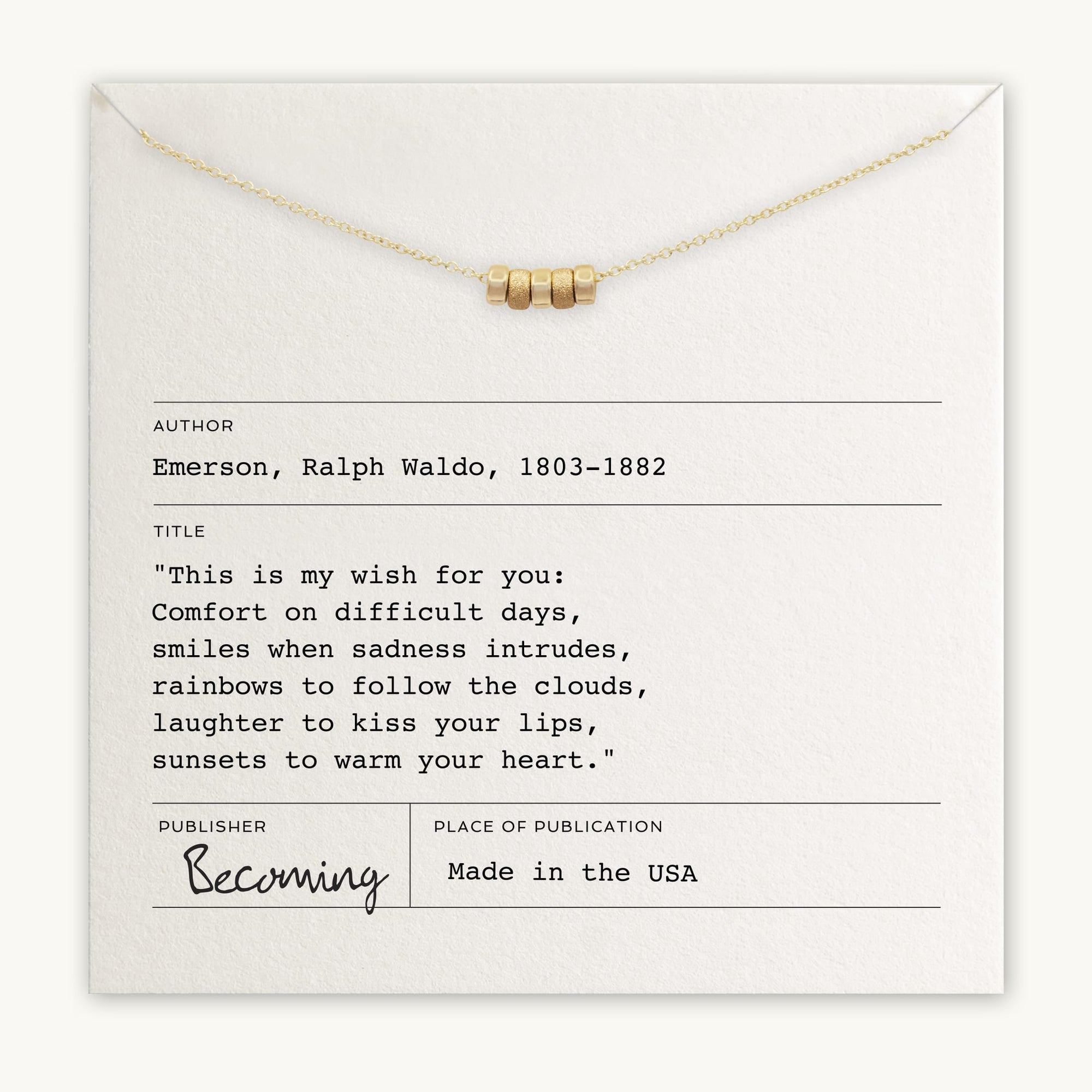 An envelope with a gold necklace on top. Below it, text attributes a Ralph Waldo Emerson quote and indicates the publisher as "Becoming Jewelry." This cherished gift, named "My Wish For You Necklace," wishes you comfort and joy.