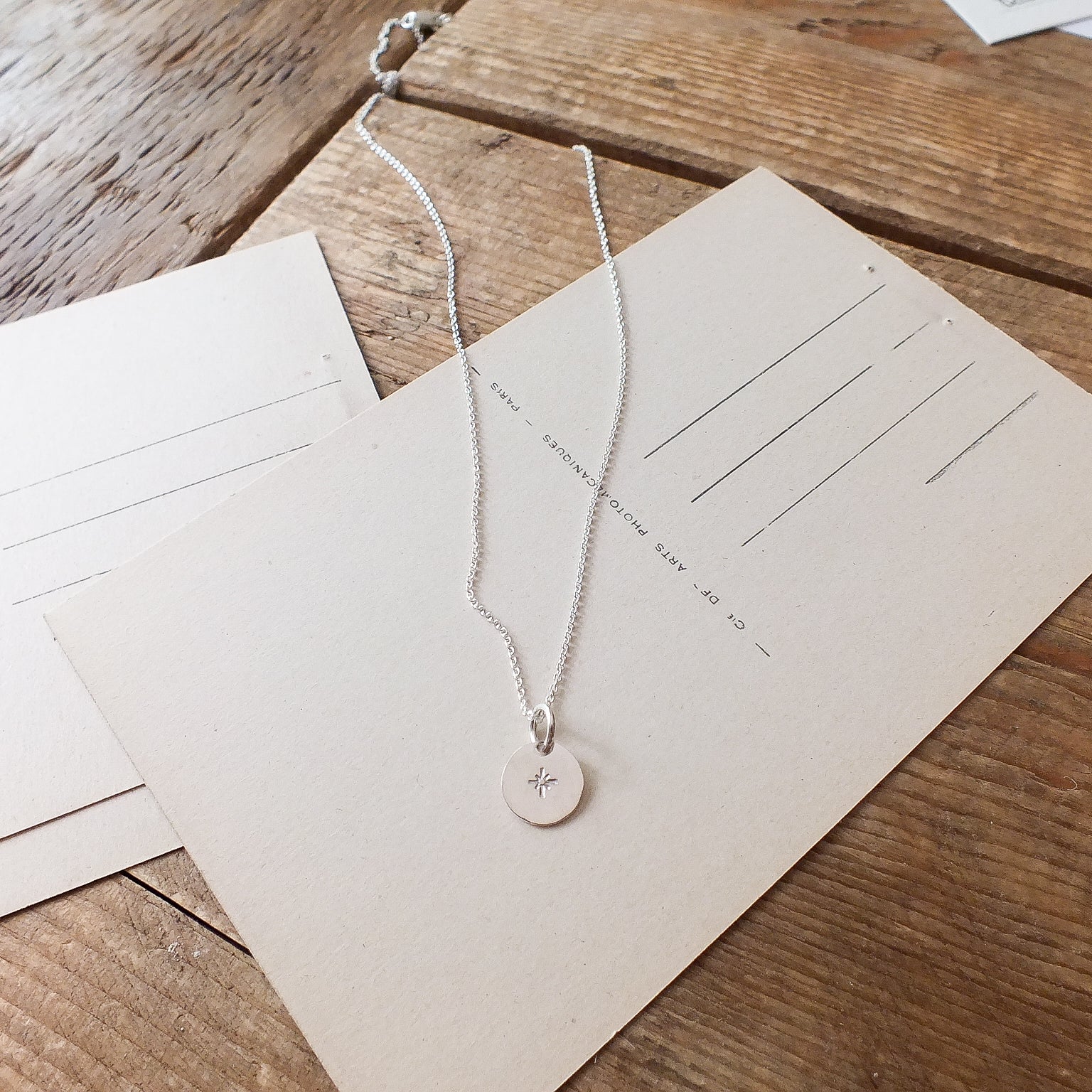 Becoming Jewelry&#39;s Light Within Necklace with a starlight charm pendant displayed on a card with necklace length options.