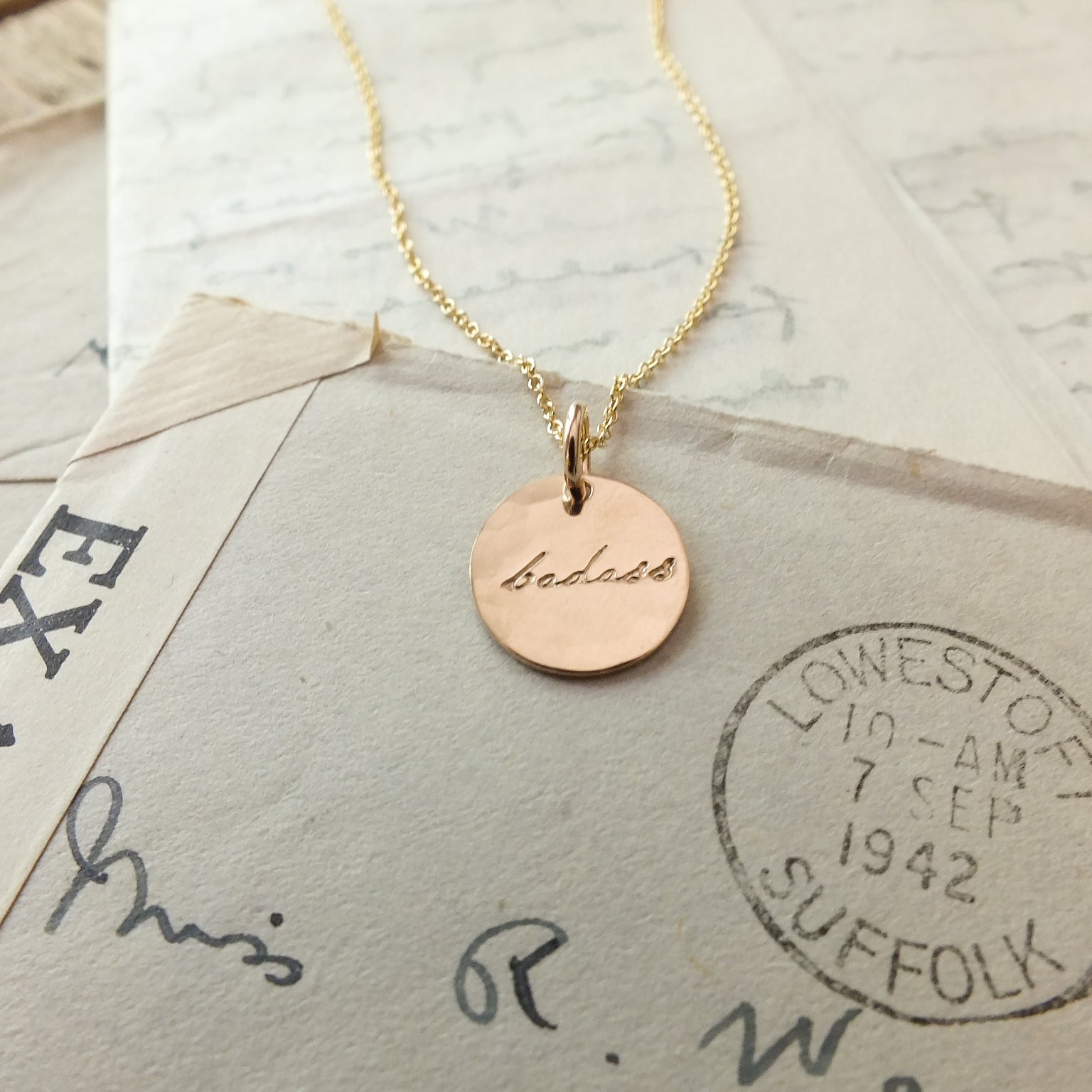 Badass Necklace with &quot;isabela&quot; inscription on a backdrop of vintage letters by Becoming Jewelry.