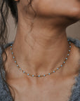 Woman wearing a turquoise beaded necklace