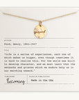 A Becoming Jewelry Onward Necklace with the word "onward" engraved on it, displayed on a necklace card with a quote from Henry Ford