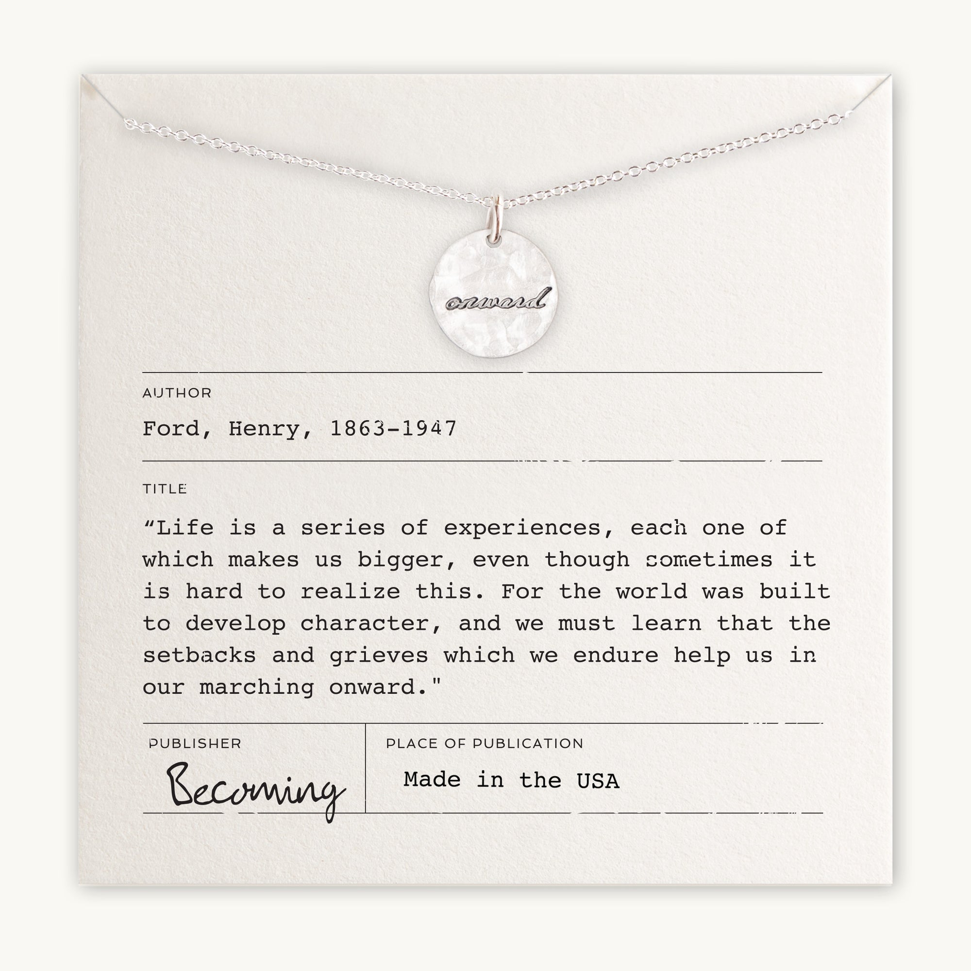 A Becoming Jewelry Onward Necklace with the word &quot;onward&quot; engraved on it, displayed on a necklace card with a quote from Henry Ford