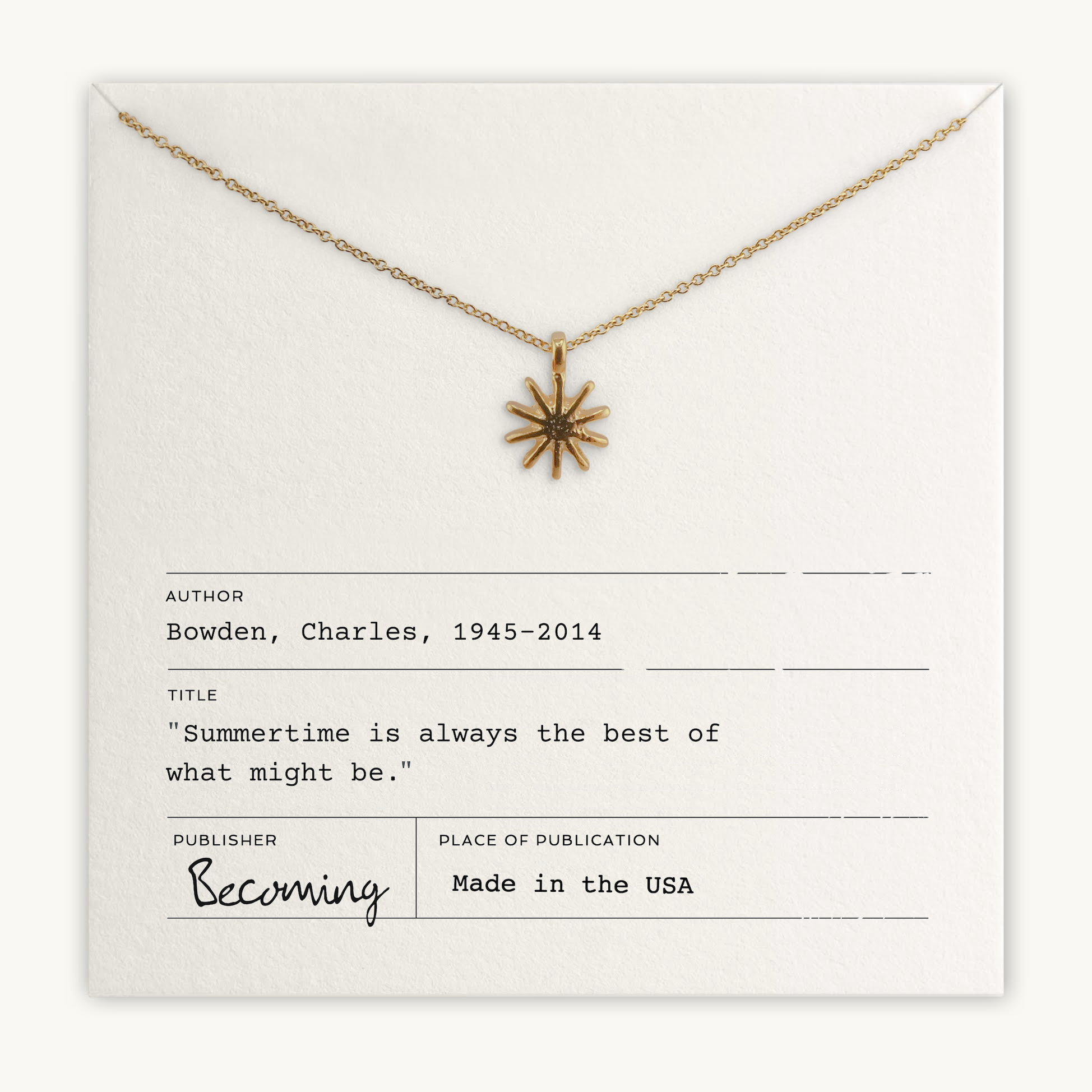 Necklace with sun-shaped pendant on a card with text