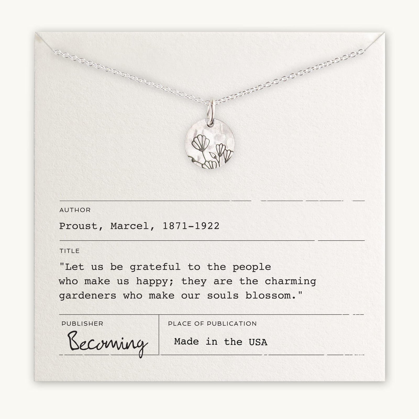 Becoming Jewelry's Blossom Necklace with a tree pendant on a card with a Marcel Proust quote about gratitude and happiness.