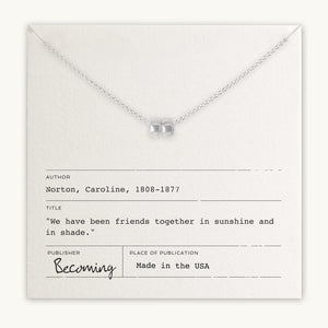 Friends Beads Necklace with a clear gemstone pendant presented on a card with a quote by Caroline Norton, featuring a fine cable chain by Becoming Jewelry.