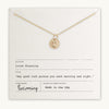 Becoming Jewelry's Horseshoe pendant necklace with Irish blessing displayed on a card.