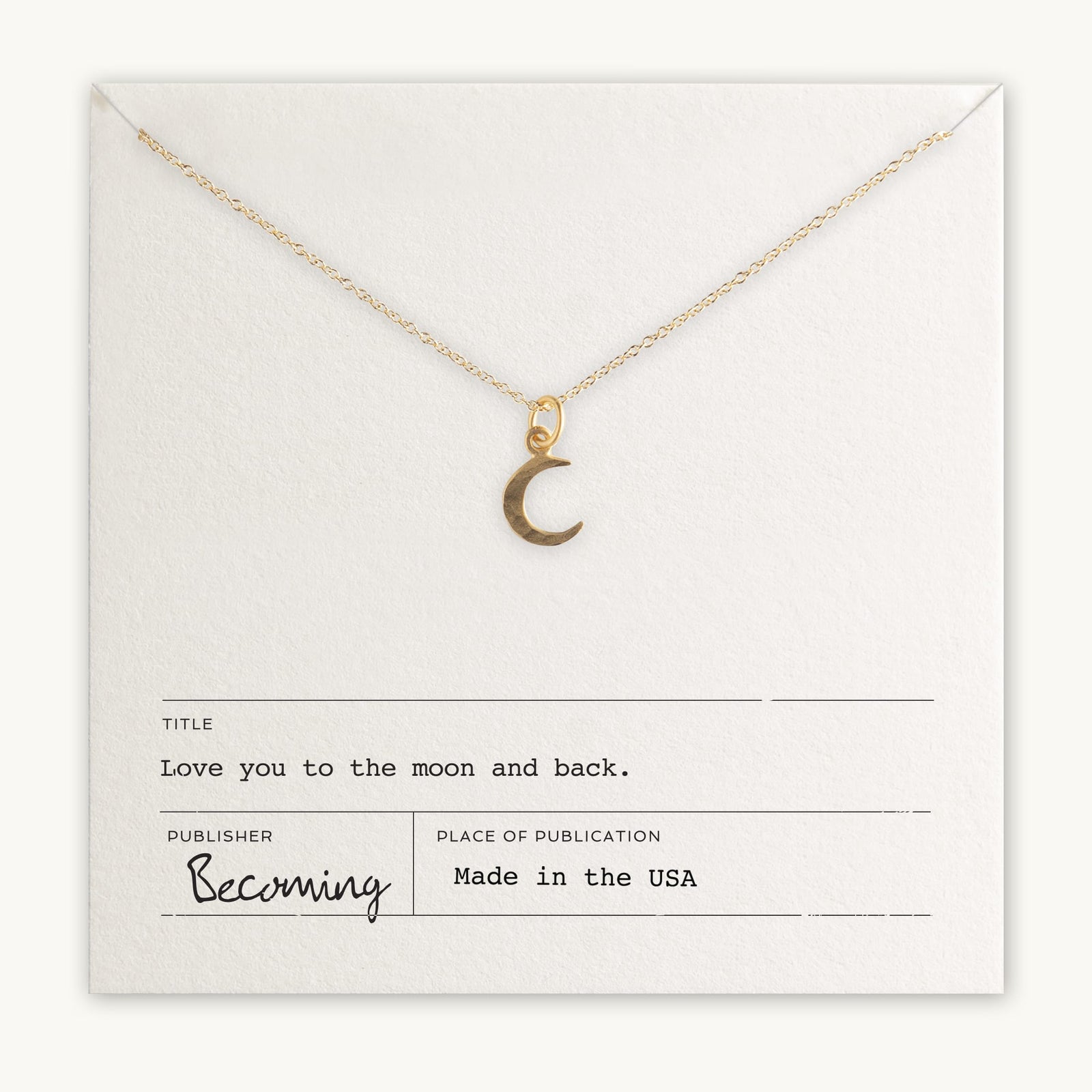 Gold-filled Love You To The Moon Necklace charm pendant on a chain displayed on a card with the inscription 