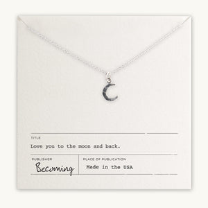 Becoming Jewelry's Love You To The Moon Necklace displayed on a card with the inscription "love you to the moon and back." made in the USA.