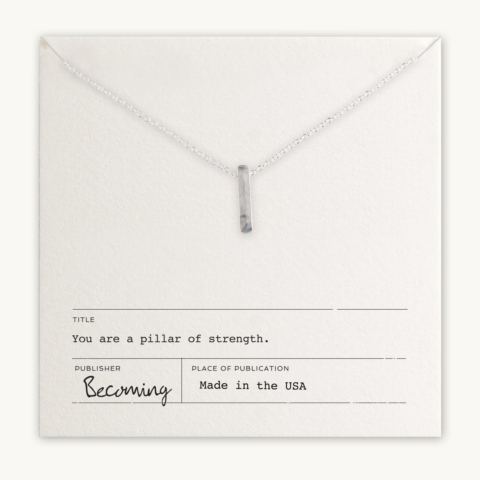 Becoming Jewelry's Pillar of Strength Necklace is a sterling silver necklace with a hammered bar drop charm on a fine cable chain, displayed on a card with the inspirational message, 