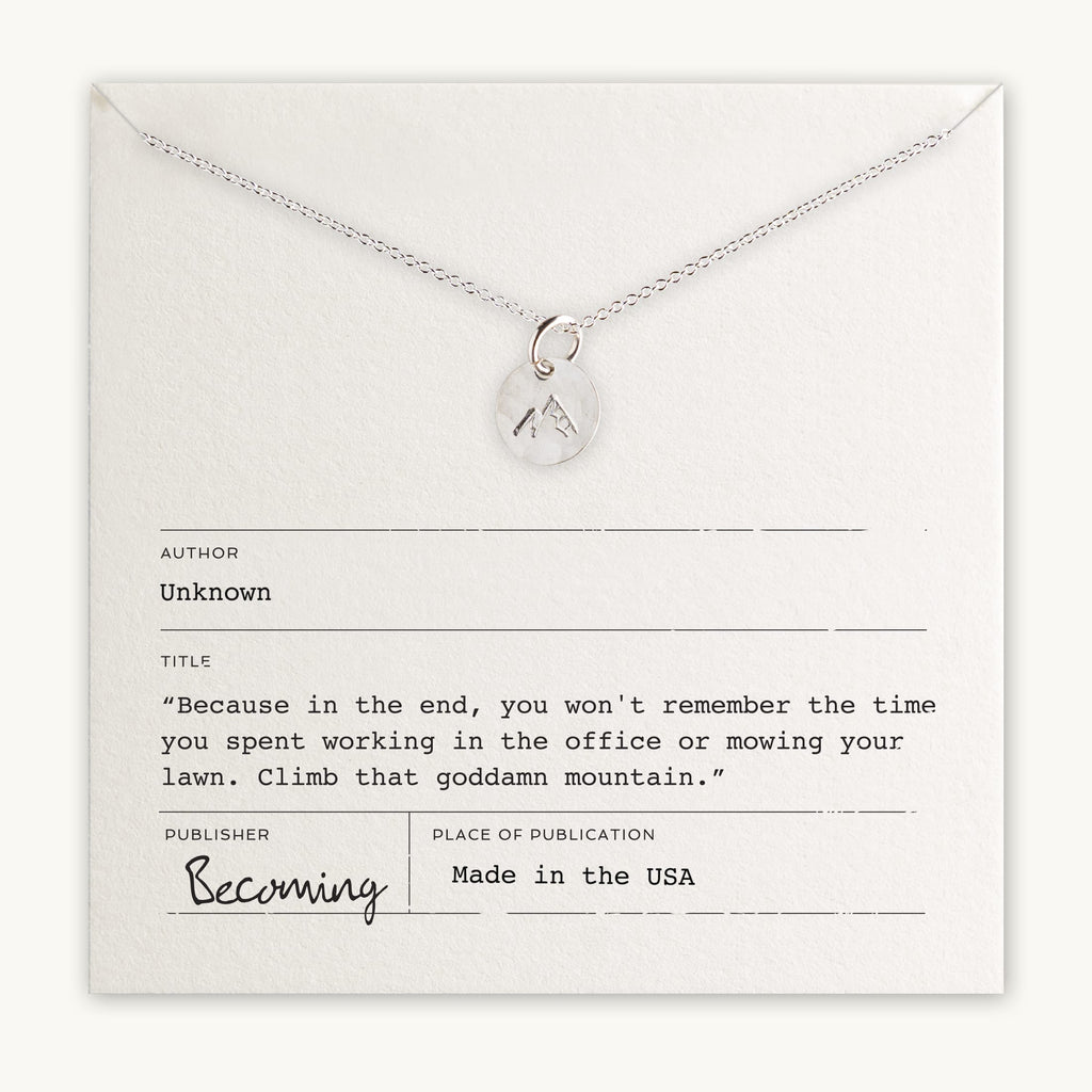 Climb That Mountain Necklace with a mountain charm pendant displayed on a card with an inspirational quote about life priorities and personal growth, titled "Becoming" by Becoming Jewelry.